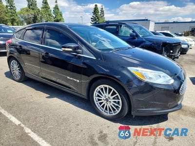 Czwarte zdjęcie samochodu z boku: 2014 FORD FOCUS BEV VIN:1FADP3R45EL311844 - miniatura