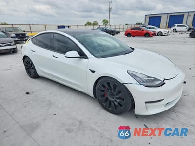 Czwarte zdjęcie samochodu z boku: 2020 TESLA MODEL 3 VIN:5YJ3E1EC4LF603238 - miniatura