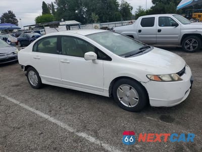 Czwarte zdjęcie samochodu z boku: 2006 HONDA CIVIC HYBRID VIN:JHMFA36226S016052 - miniatura