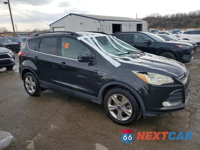 Czwarte zdjęcie samochodu z boku: 2015 FORD ESCAPE SE VIN:1FMCU0G90FUB91972 - miniatura