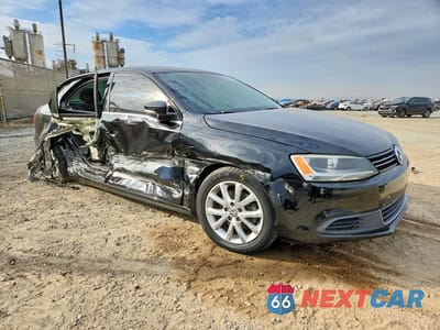 Czwarte zdjęcie samochodu z boku: 2014 VOLKSWAGEN JETTA SE VIN:3VWD17AJ1EM374049 - miniatura