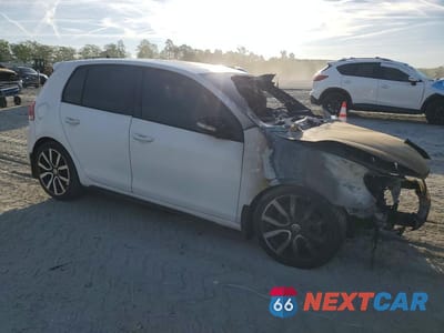 Czwarte zdjęcie samochodu z boku: 2014 VOLKSWAGEN GTI VIN:WVWHD7AJ5EW010843 - miniatura