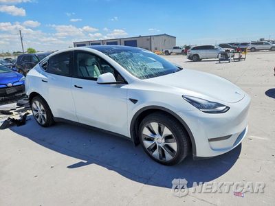 Czwarte zdjęcie samochodu z boku: 2023 TESLA MODEL Y VIN:7SAYGDEE6PA080071 - miniatura