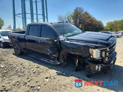 Czwarte zdjęcie samochodu z boku: 2020 GMC SIERRA K2500 AT4 VIN:1GT49PEY2LF243938 - miniatura