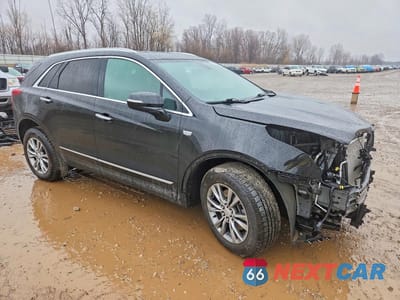 Czwarte zdjęcie samochodu z boku: 2022 CADILLAC XT5 PREMIUM LUXURY VIN:1GYKNDRS6NZ136717 - miniatura
