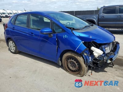 Czwarte zdjęcie samochodu z boku: 2015 HONDA FIT LX VIN:3HGGK5H59FM722404 - miniatura