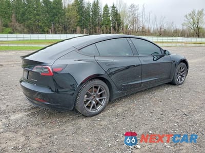 Trzecie zdjęcie samochodu z tyłu: 2021 TESLA MODEL 3 VIN:5YJ3E1EB1MF064246 - miniatura
