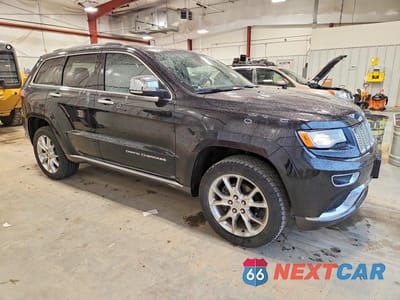 Czwarte zdjęcie samochodu z boku: 2015 JEEP GRAND CHEROKEE SUMMIT VIN:1C4RJFJG5FC741867 - miniatura