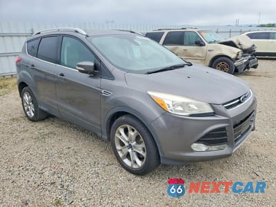Czwarte zdjęcie samochodu z boku: 2014 FORD ESCAPE TITANIUM VIN:1FMCU0JX7EUB48011 - miniatura