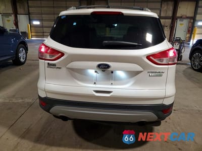 Zdjęcie 6 z 13 samochodu: 2013 FORD ESCAPE TITANIUM VIN:1FMCU0J92DUD67913 - miniatura
