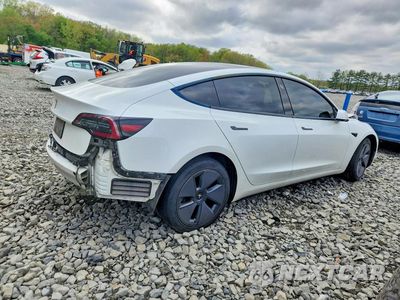 Trzecie zdjęcie samochodu z tyłu: 2023 TESLA MODEL 3 VIN:5YJ3E1EAXPF473325 - miniatura