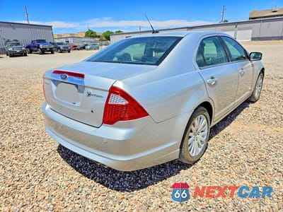 Czwarte zdjęcie samochodu z boku: 2010 FORD FUSION HYBRID VIN:3FADP0L30AR366647 - miniatura