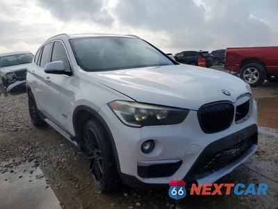 Czwarte zdjęcie samochodu z boku: 2017 BMW X1 XDRIVE28I VIN:WBXHT3C32H5F83385 - miniatura