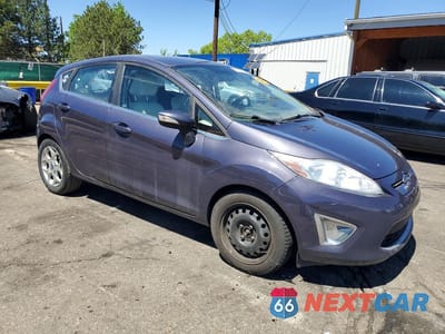 Czwarte zdjęcie samochodu z boku: 2013 FORD FIESTA VIN:3FADP4FJXDM144295 - miniatura