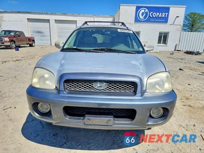 Piąte zdjęcie samochodu w środku: 2001 HYUNDAI SANTA FE GL VIN:KM8SC83D61U021549 - miniatura