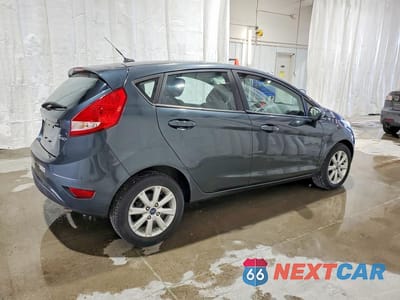 Trzecie zdjęcie samochodu z tyłu: 2011 FORD FIESTA SE VIN:3FADP4EJ8BM134069 - miniatura