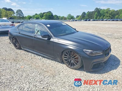 Czwarte zdjęcie samochodu z boku: 2017 BMW 750 I VIN:WBA7F0C32HGM22242 - miniatura