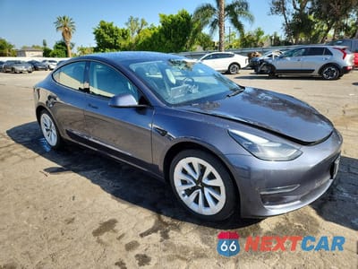 Czwarte zdjęcie samochodu z boku: 2023 TESLA MODEL 3 VIN:5YJ3E1EA3PF447794 - miniatura