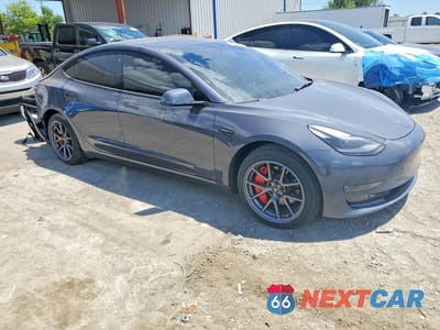 Czwarte zdjęcie samochodu z boku: 2022 TESLA MODEL 3 VIN:5YJ3E1EB7NF323016 - miniatura
