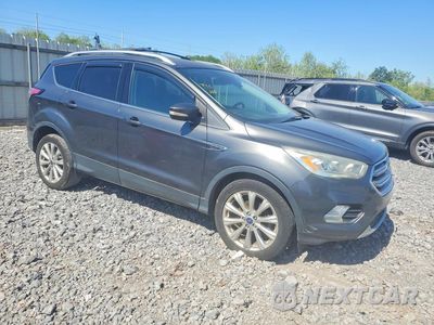 Czwarte zdjęcie samochodu z boku: 2017 FORD ESCAPE TITANIUM VIN:1FMCU0JD9HUD03734 - miniatura