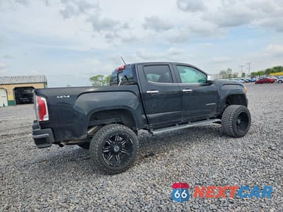 Trzecie zdjęcie samochodu z tyłu: 2015 GMC CANYON SLT VIN:1GTG6CE3XF1259308 - miniatura