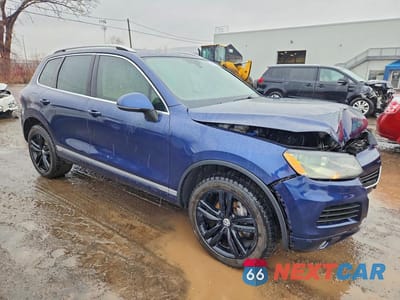 Czwarte zdjęcie samochodu z boku: 2014 VOLKSWAGEN TOUAREG V6 TDI VIN:WVGEP9BP4ED010459 - miniatura