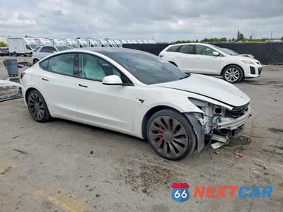 Czwarte zdjęcie samochodu z boku: 2022 TESLA MODEL 3 VIN:5YJ3E1ECXNF108996 - miniatura