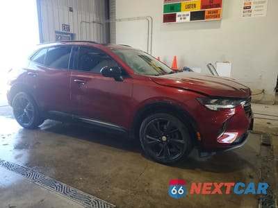 Czwarte zdjęcie samochodu z boku: 2021 BUICK ENVISION ESSENCE VIN:LRBFZPR4XMD167395 - miniatura