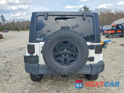 Zdjęcie 6 z 12 samochodu: 2012 JEEP WRANGLER UNLIMITED SAHARA VIN:1C4BJWEG3CL277680 - miniatura