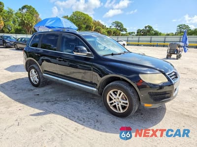 Czwarte zdjęcie samochodu z boku: 2010 VOLKSWAGEN TOUAREG TDI VIN:WVGFK7A90AD000497 - miniatura
