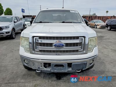 Piąte zdjęcie samochodu w środku: 2014 FORD F150 SUPERCREW VIN:1FTFW1EFXEKD60559 - miniatura