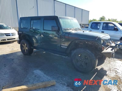 Czwarte zdjęcie samochodu z boku: 2010 JEEP WRANGLER UNLIMITED SPORT VIN:1J4HA3H12AL125218 - miniatura