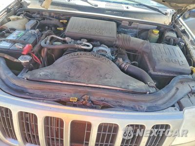 Zdjęcie 12 z 13 samochodu: 1999 JEEP GRAND CHEROKEE LIMITED VIN:1J4GW68N8XC670513 - miniatura