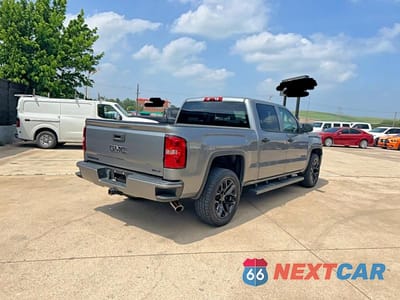 Czwarte zdjęcie samochodu z boku: 2014 GMC SIERRA K1500 SLT VIN:3GTU2VEC1EG554615 - miniatura