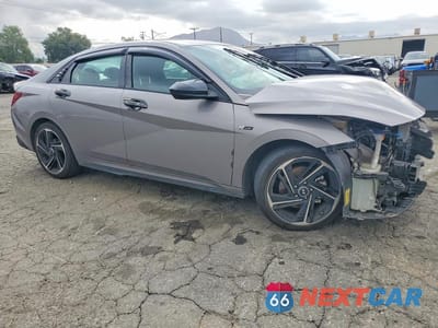 Czwarte zdjęcie samochodu z boku: 2023 HYUNDAI ELANTRA N LINE VIN:KMHLR4AFXPU611083 - miniatura