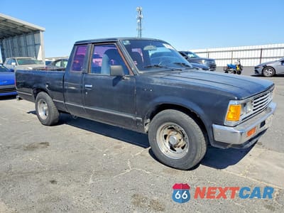 Czwarte zdjęcie samochodu z boku: 1985 NISSAN PICKUP BASE VIN:JN6ND06S5FW007516 - miniatura