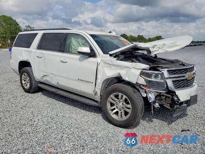 Czwarte zdjęcie samochodu z boku: 2019 CHEVROLET SUBURBAN C1500 LT VIN:1GNSCHKC0KR143994 - miniatura