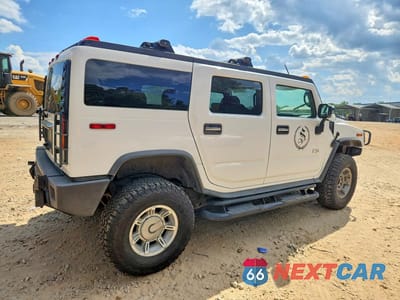 Trzecie zdjęcie samochodu z tyłu: 2003 HUMMER H2 VIN:5GRGN23U43H130412 - miniatura