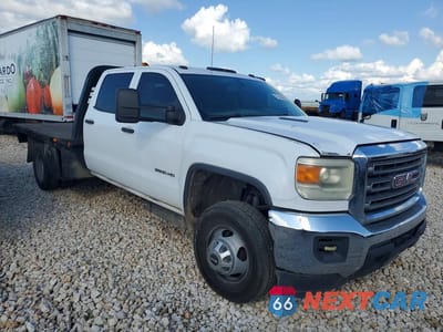 Czwarte zdjęcie samochodu z boku: 2015 GMC SIERRA C3500 VIN:1GD411C86FF151058 - miniatura