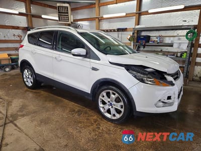 Czwarte zdjęcie samochodu z boku: 2014 FORD ESCAPE TITANIUM VIN:1FMCU0J95EUB07197 - miniatura