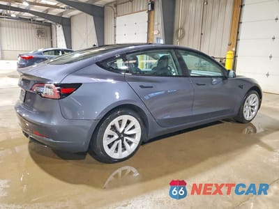 Trzecie zdjęcie samochodu z tyłu: 2023 TESLA MODEL 3 VIN:5YJ3E1EA9PF449176 - miniatura