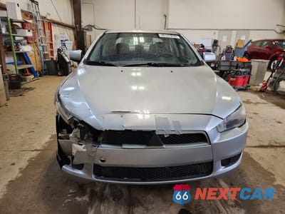 Piąte zdjęcie samochodu w środku: 2009 MITSUBISHI LANCER ES 4DR VIN:JA3AU26U39U608808 - miniatura