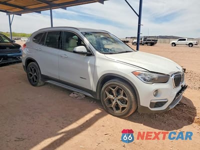 Czwarte zdjęcie samochodu z boku: 2018 BMW X1 XDRIVE28I VIN:WBXHT3C37J5L24779 - miniatura