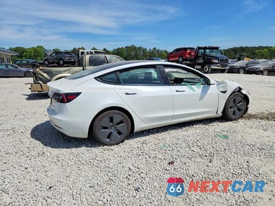 Trzecie zdjęcie samochodu z tyłu: 2022 TESLA MODEL 3 VIN:5YJ3E1EB1NF189118 - miniatura