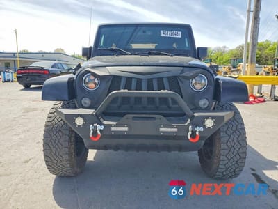 Piąte zdjęcie samochodu w środku: 2014 JEEP WRANGLER UNLIMITED SAHARA VIN:1C4HJWEG0EL271977 - miniatura