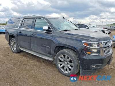 Czwarte zdjęcie samochodu z boku: 2015 CHEVROLET SUBURBAN K1500 LT VIN:1GNSKJKC7FR141708 - miniatura