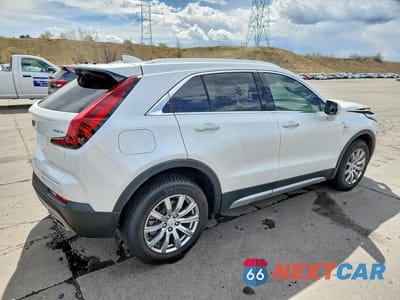 Trzecie zdjęcie samochodu z tyłu: 2022 CADILLAC XT4 PREMIUM LUXURY VIN:1GYFZDR49NF100593 - miniatura