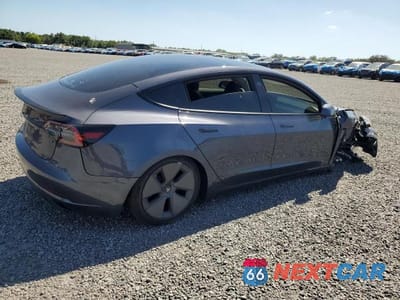 Trzecie zdjęcie samochodu z tyłu: 2023 TESLA MODEL 3 VIN:5YJ3E1EA1PF693002 - miniatura