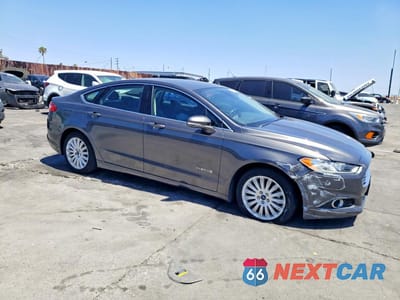Czwarte zdjęcie samochodu z boku: 2016 FORD FUSION HYBRID VIN:3FA6P0LU9GR187064 - miniatura