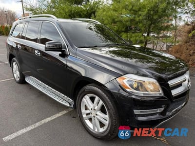 Czwarte zdjęcie samochodu z boku: 2015 MERCEDES-BENZ GL 450 4MATIC VIN:4JGDF6EE5FA448045 - miniatura